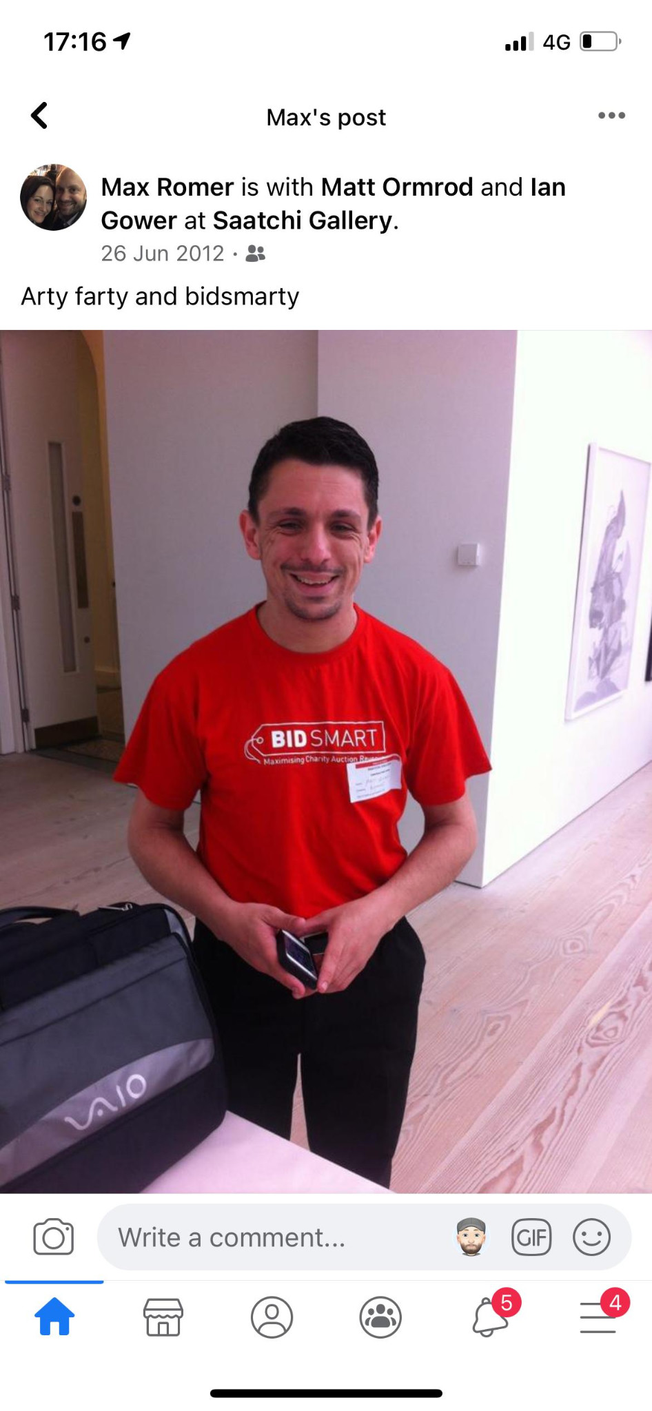 Screenshot of a social post showing a person wearing a red BidSmart shirt in a gallery